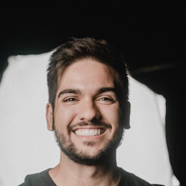 Smiling man dark background portrait